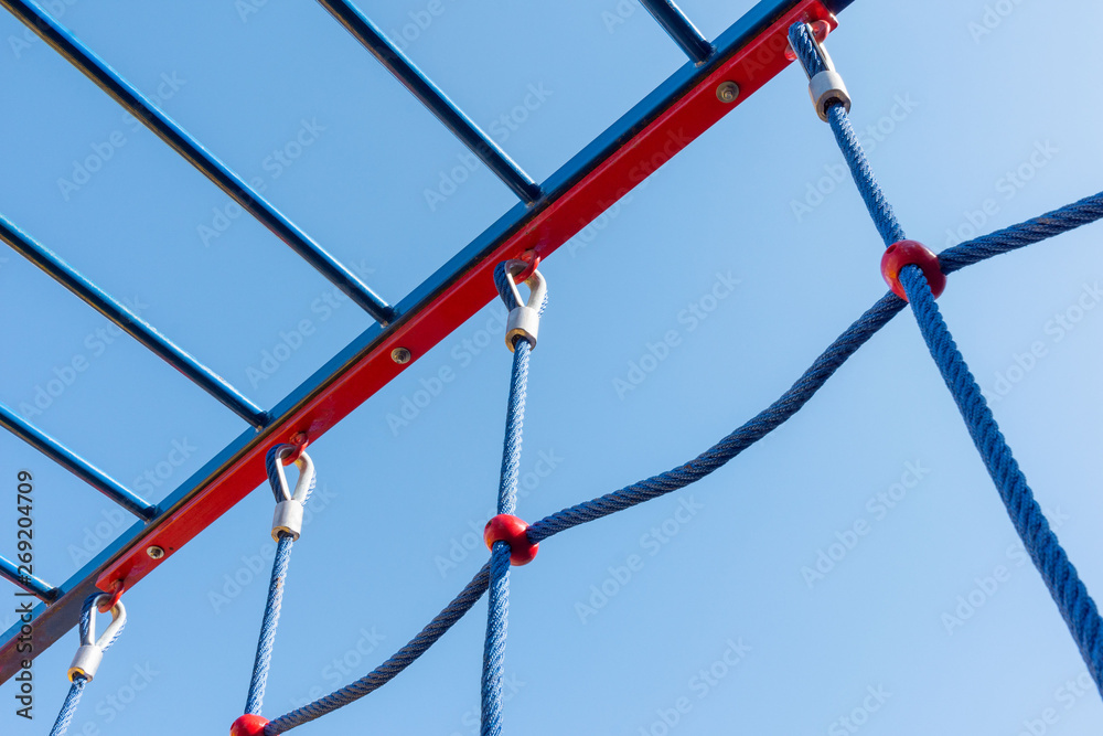 Network and nylon rope on the playground. Equipment for fun and sports for children