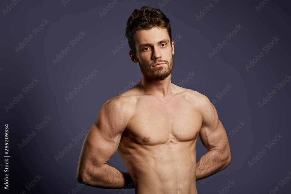 the result of daily training, athlete with helathy skin and well-built body posing to the camera. close up photo. the result of daily training, athlete with helathy skin and well-built body posing to the camera. close up photo.