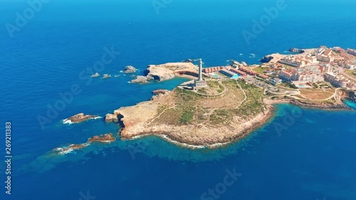 Aerial view. Lighthouse on island, Spain meditterian sea. photo