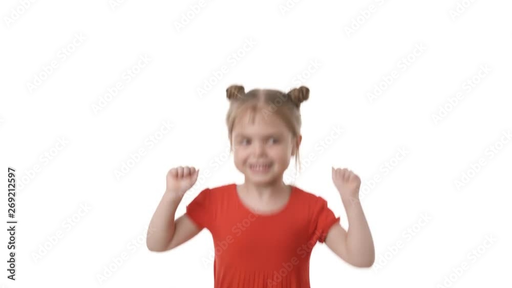 Video portrait of a beautiful girl in red dress jumping isolated on white background. Childhood concept. Studio shot of child emotions in 4K definition. Video portrait of a beautiful girl in red dress jumping isolated on white background. Childhood concept. Studio shot of child emotions in 4K definition.