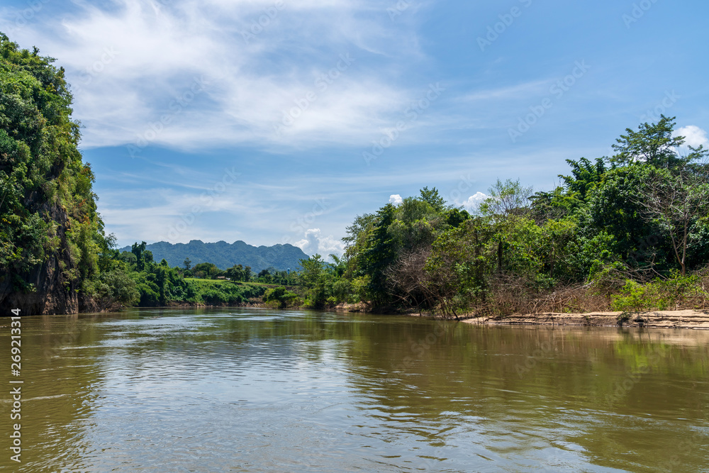 Blue sky high peak mountains fog hills mist scenery river lake dam bay gulf wildlife National park views Kanchanaburi, Thailand. Blue sky high peak mountains fog hills mist scenery river lake dam bay gulf wildlife National park views Kanchanaburi, Thailand.