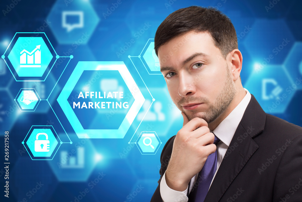 The concept of business, technology, the Internet and the network. A young entrepreneur working on a virtual screen of the future and sees the inscription: Affiliate marketing The concept of business, technology, the Internet and the network. A young entrepreneur working on a virtual screen of the future and sees the inscription: Affiliate marketing