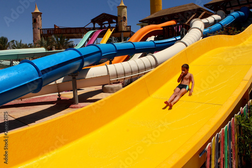 A child riding a water slide