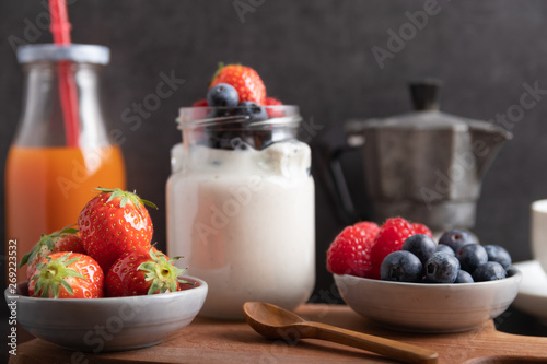yogurt with fruit on a breakfast table