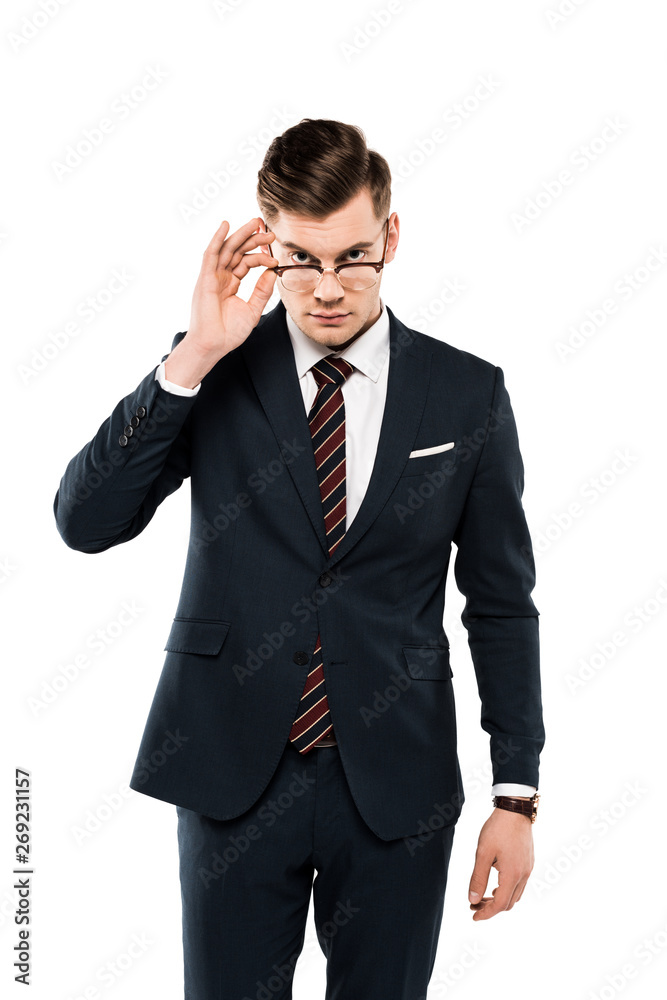 handsome businessman touching glasses while looking at camera isolated on white handsome businessman touching glasses while looking at camera isolated on white