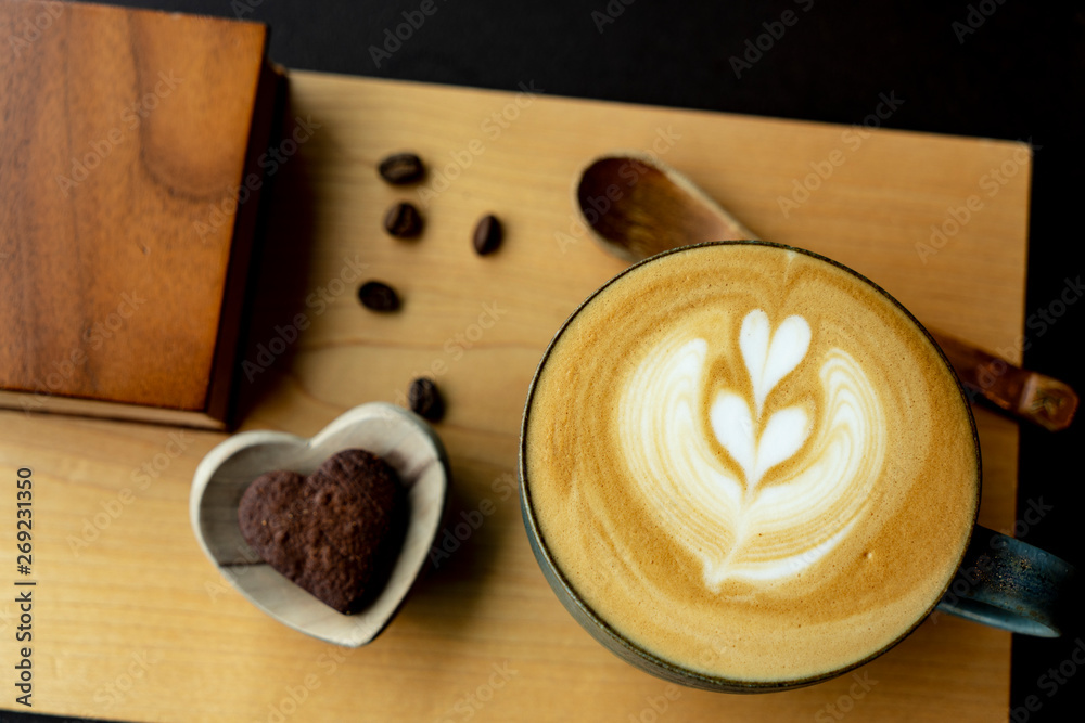 serving coffee ray with heart shape cookie
