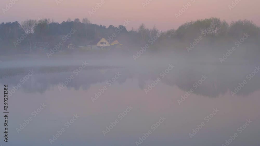 The village is foggy in the morning, the calm flow of the river is mystical fog. The village is foggy in the morning, the calm flow of the river is mystical fog.