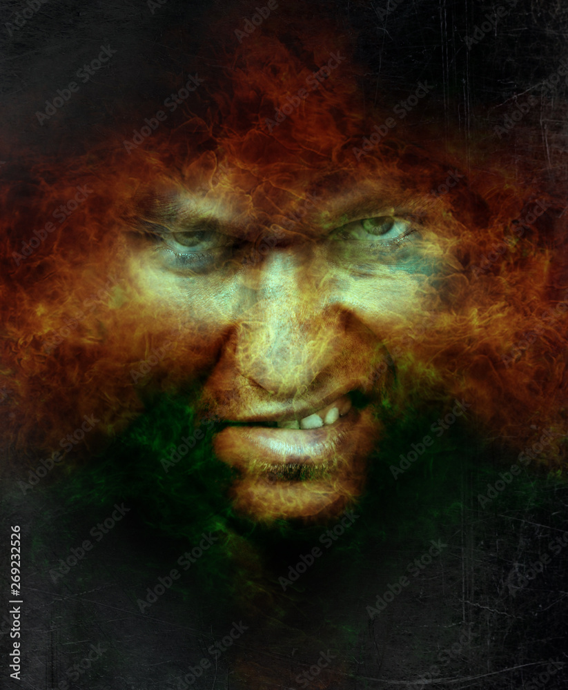Scary angry male face over hell fire Scary angry male face over hell fire