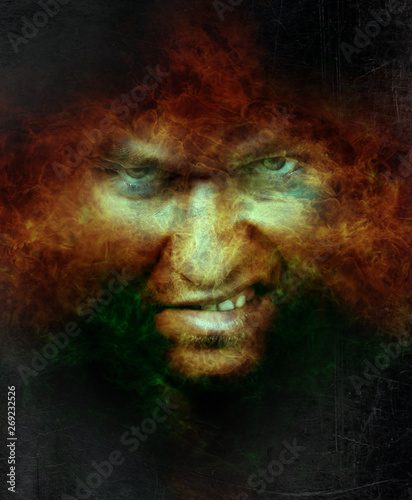 Scary angry male face over hell fire