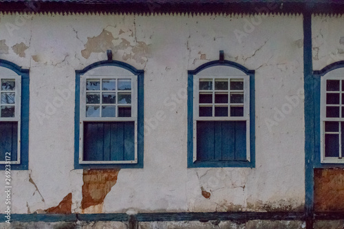 Large colonial house  white walls with blue windows and blue wooden beams  goias