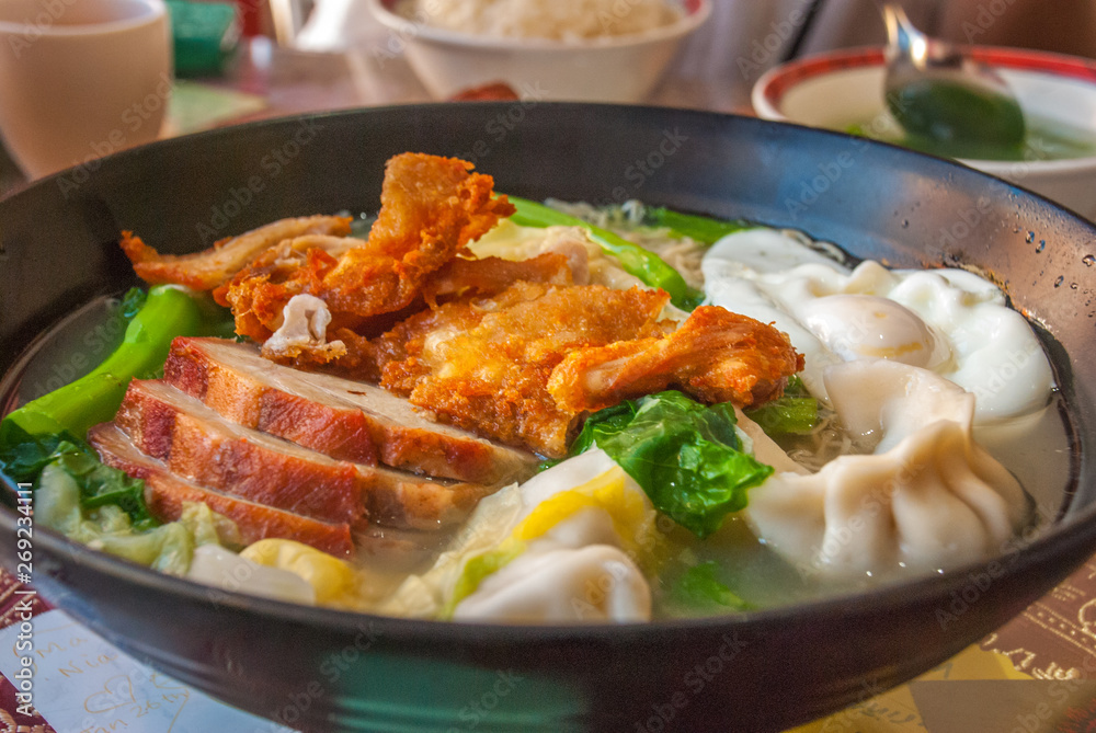 Red pork noodles, fried chicken, dumplings, fried eggs, vegetables and soups. Red pork noodles, fried chicken, dumplings, fried eggs, vegetables and soups.