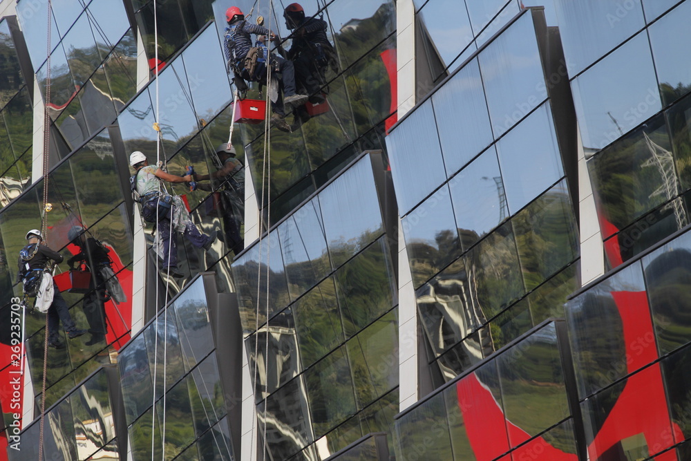 Fototapeta premium Cleaners working at height
