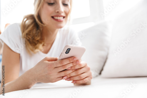 Beautiful young woman relaxing on a couch