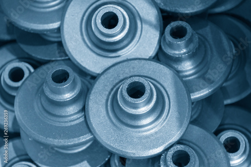 The casting iron parts in the light blue scene. The products of die casting process.