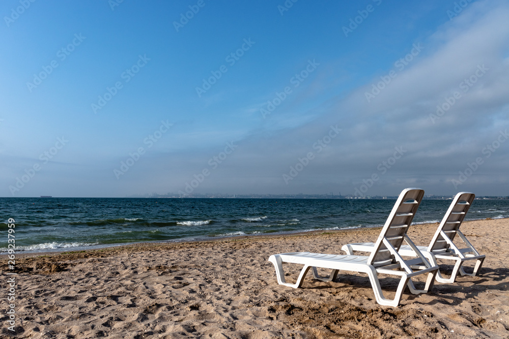 chaise lounges on the sea