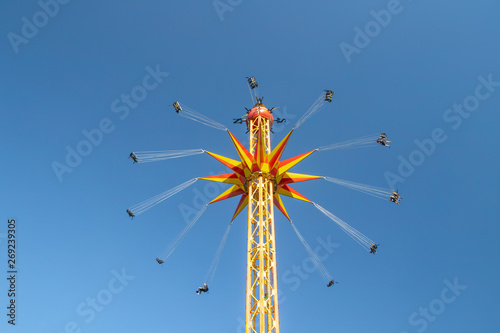 Kouvola, Finland - 18 May 2019: Ride Star Flyer in motion on sky background in amusement park Tykkimaki