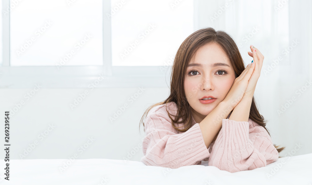 Portrait of young beautiful sexy asian woman relax in her bedroom. Smile happy face asian girl isolated on white background. Beauty treatment perfect clear skin japanese makeup lifestyle concept Portrait of young beautiful sexy asian woman relax in her bedroom. Smile happy face asian girl isolated on white background. Beauty treatment perfect clear skin japanese makeup lifestyle concept
