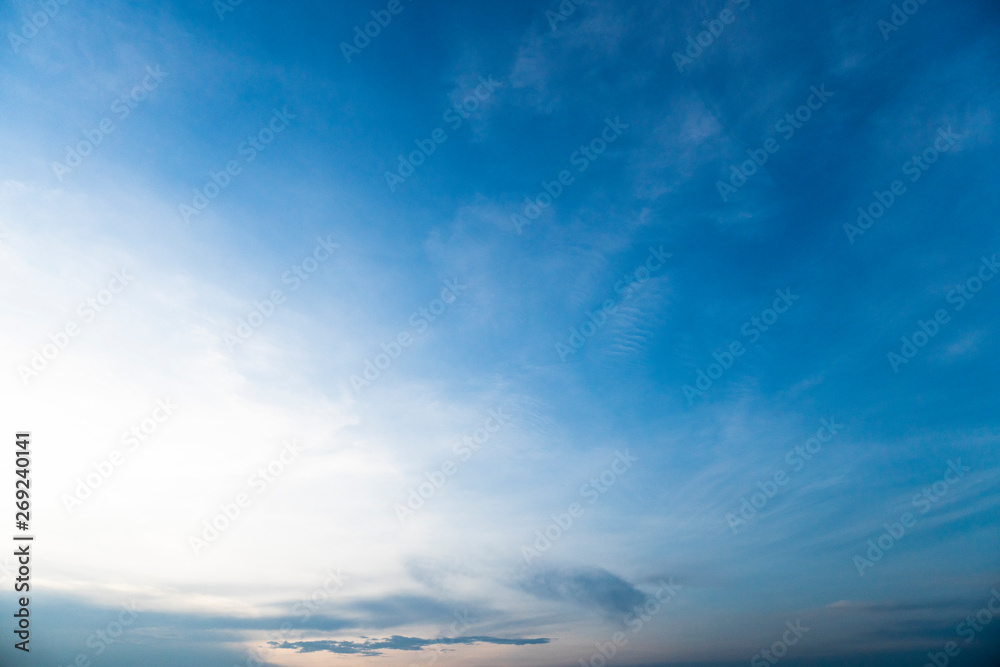Beautiful blue sky with cloud and small orange color in the lower part for nature background.