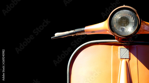 Vintage Vespa scooter parking isolated on dark background