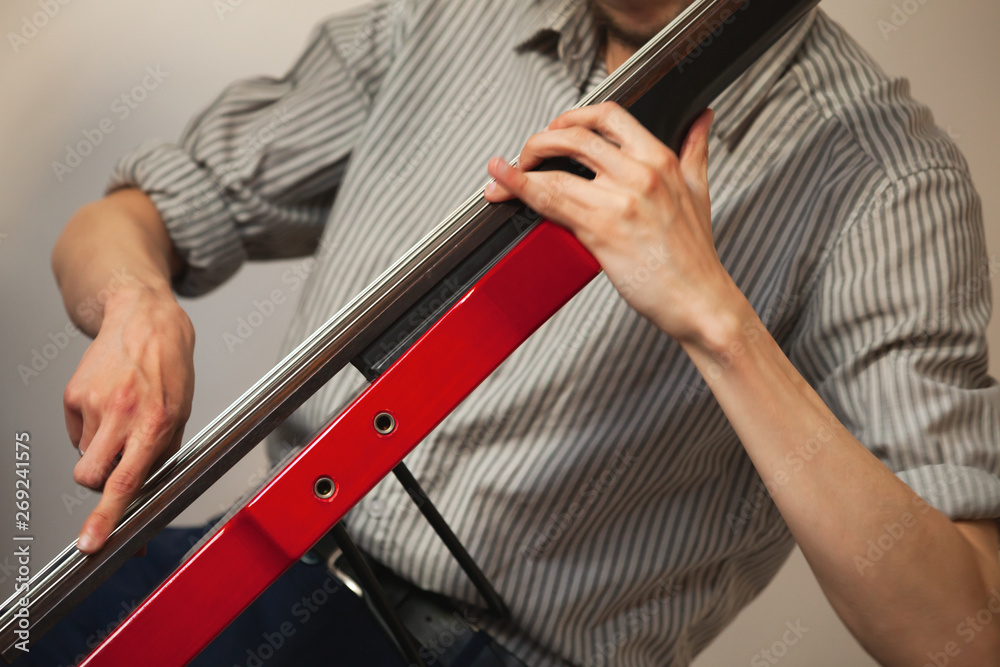 Hands of a man цшер electric contrabass Hands of a man цшер electric contrabass