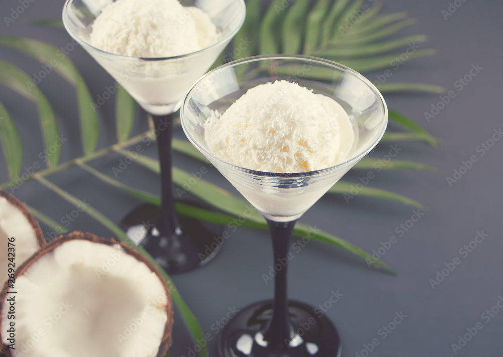 Coconut ice cream on the with palm leaf and coconut