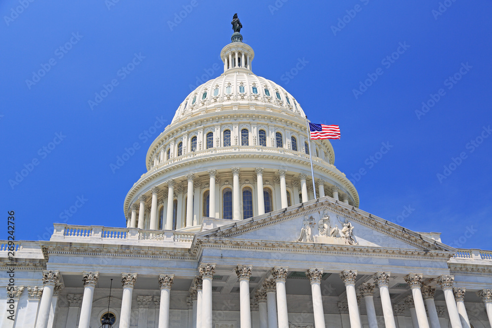National Capitol building with US flag in Washington DC, USA National Capitol building with US flag in Washington DC, USA