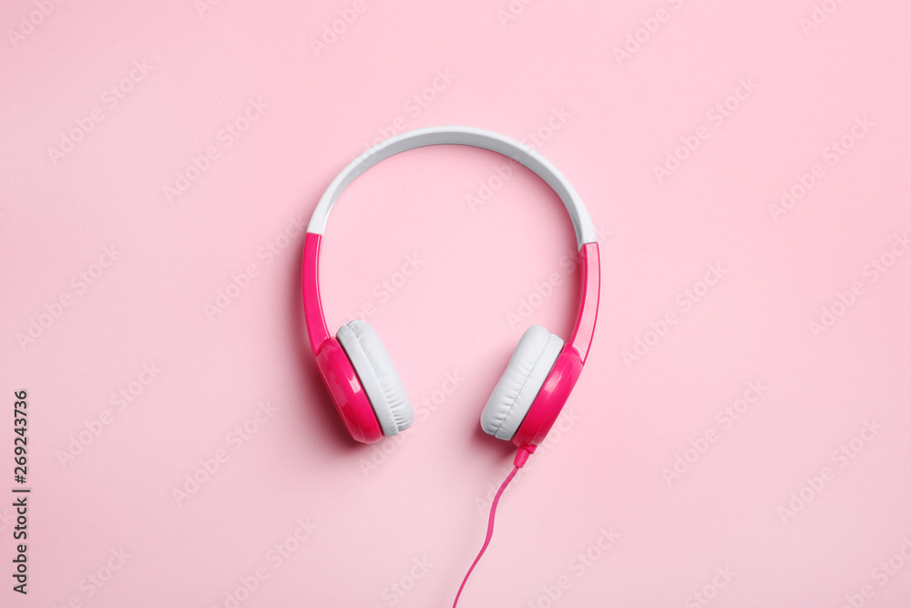 Stylish headphones on color background, top view Stylish headphones on color background, top view