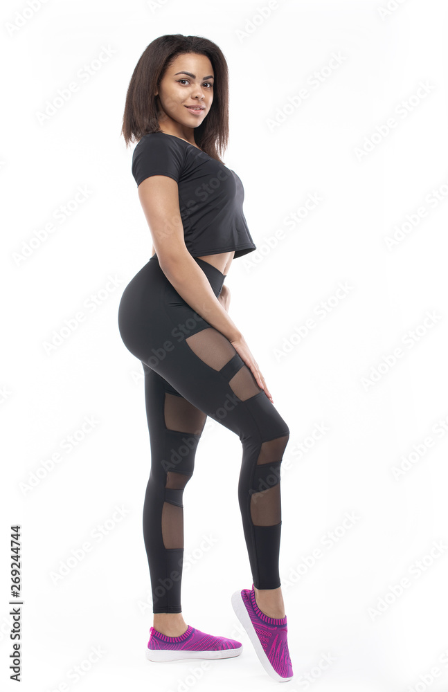 fitness woman in sport style standing against white background. fitness woman in sport style standing against white background.