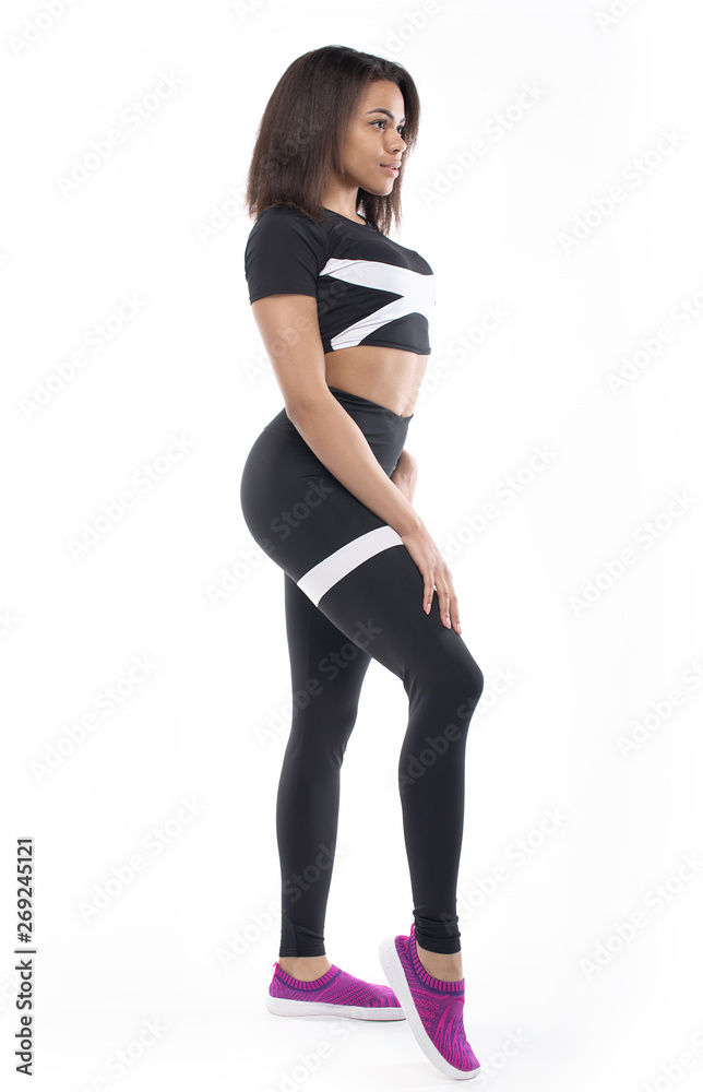 Full length portrait of a young fitness woman in sportswear posing a isolated over white background Full length portrait of a young fitness woman in sportswear posing a isolated over white background