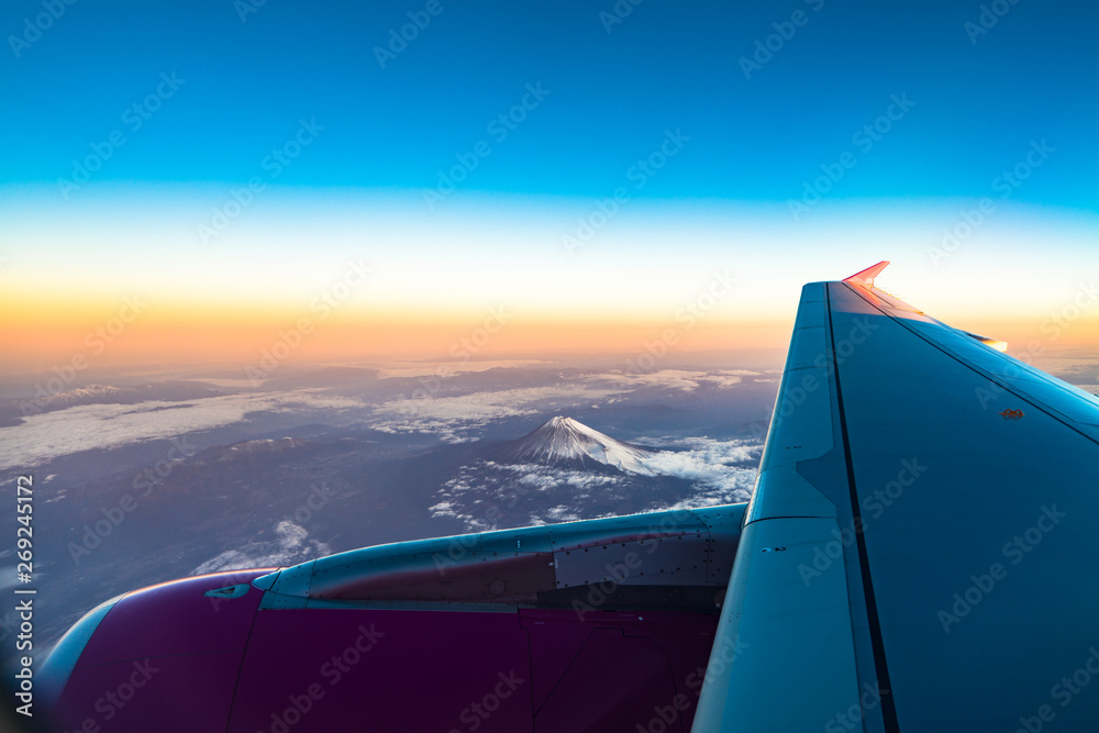 clouds sky skyscape and fuji mountain. Sunrise view from the window of an airplane flying in the clouds, top view clouds like the sea of clouds sky background, Aerial view background, Yamanashi, Japan