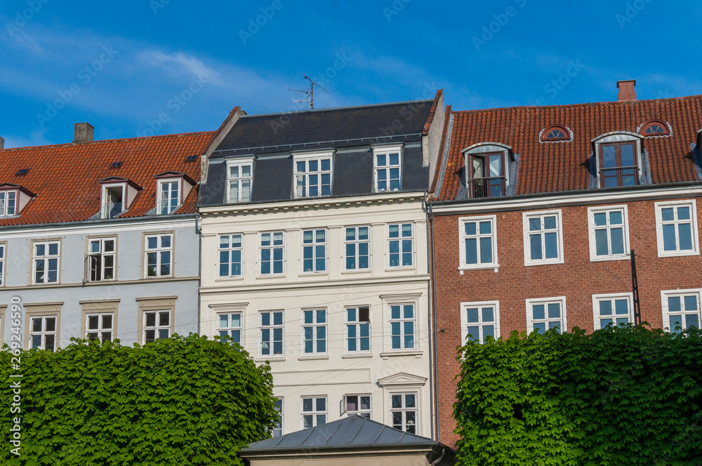 Scenic summer view of the ancient classic colorful houses with blue sky in Copenhagen, Denmark