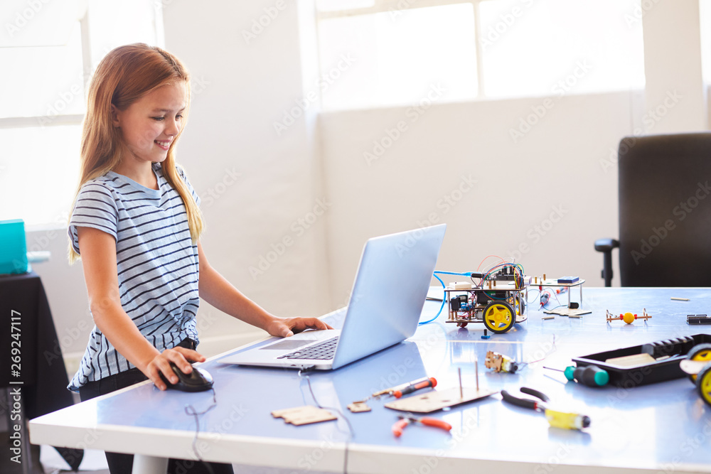 Female Student Building And Programing Robot Vehicle In After School Computer Coding Class Female Student Building And Programing Robot Vehicle In After School Computer Coding Class