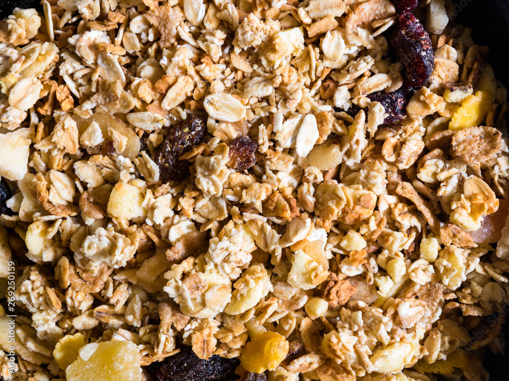 Top view of crunchy muesli with granola and dried fruits. Top view of crunchy muesli with granola and dried fruits.