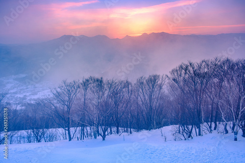 Sunset view on the top of Moiwa mountain in winter snow.