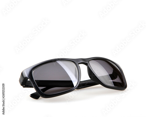Close-Up Of Black Sunglasses Against White Background