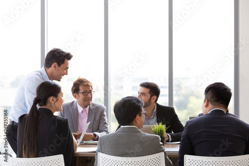 Chief businessman standing at conference table during team meeting, Entrepreneurs making deal starting collaboration at group negotiations teamwork