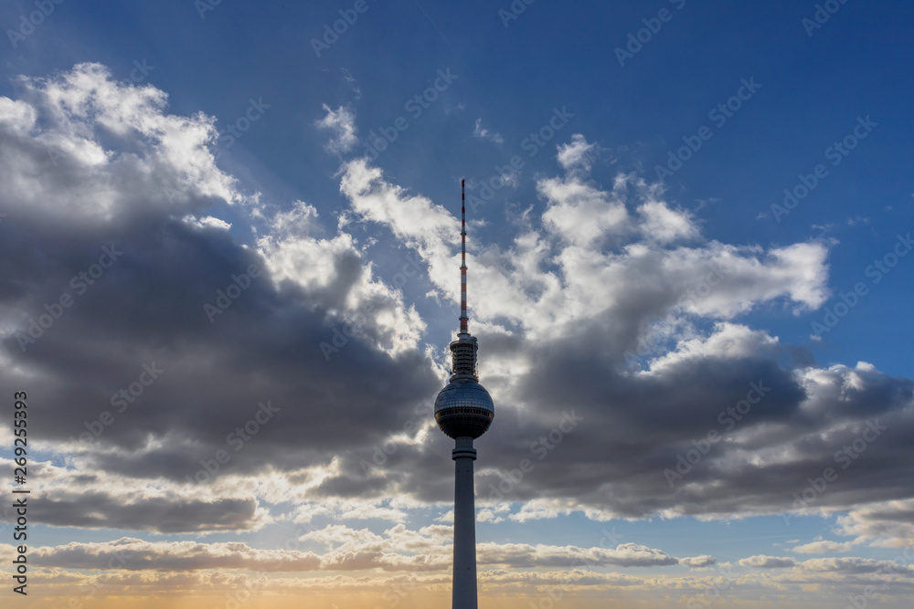 berlin tv tower in front of an evening cloudscape