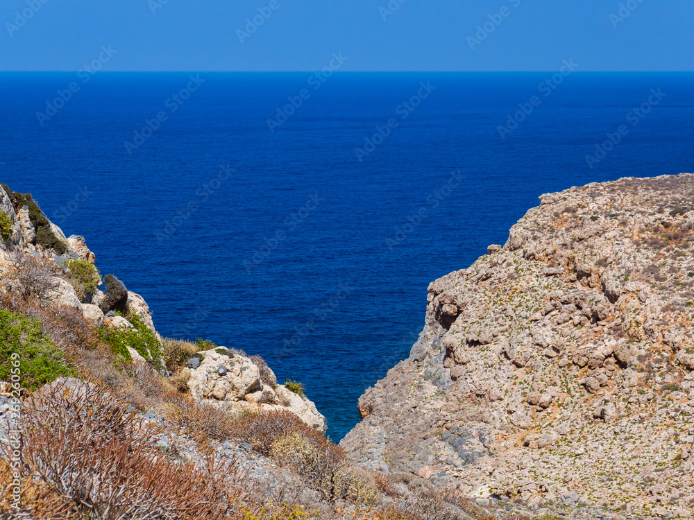 Beautiful view of the blue sea and rock cliffs