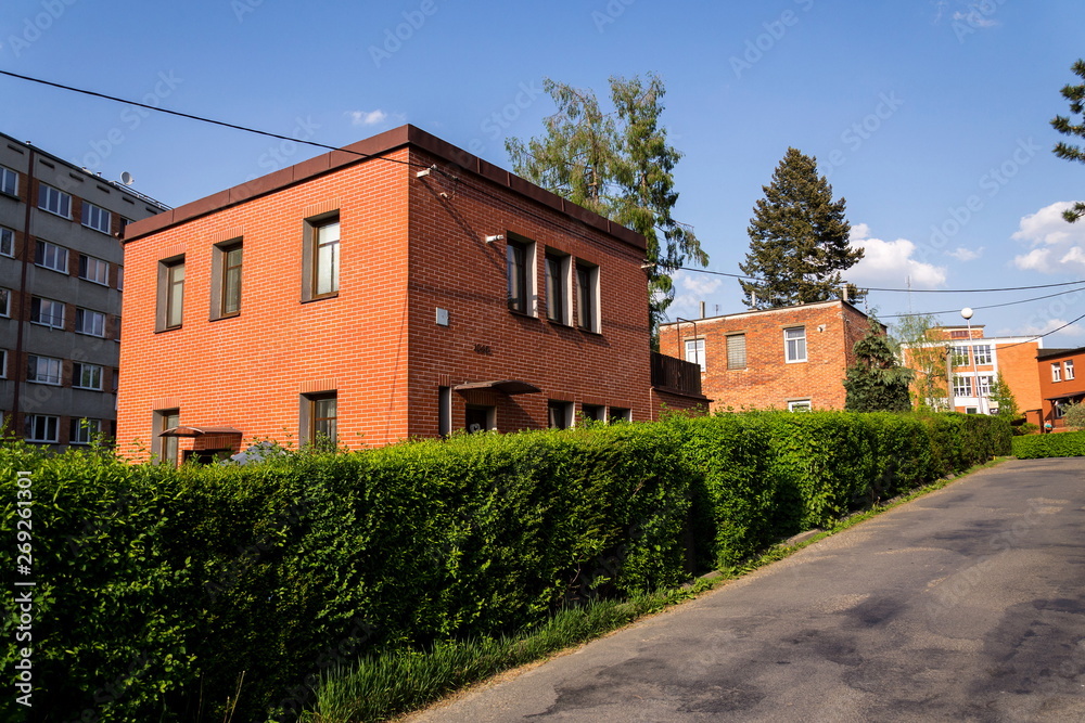 Typified red brick family Bata houses in Zlin, Moravia, Czech Republic, sunny summer day, street view