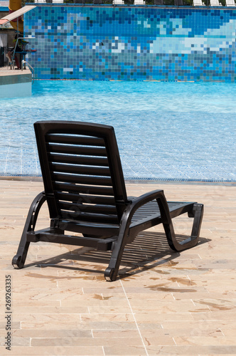 pool chair by the pool on a sunny day