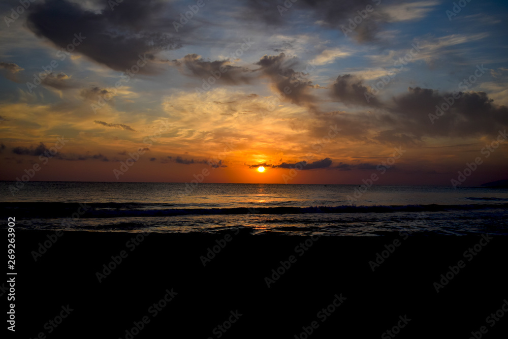 Romantic sunset sky and tropical sea at dusk