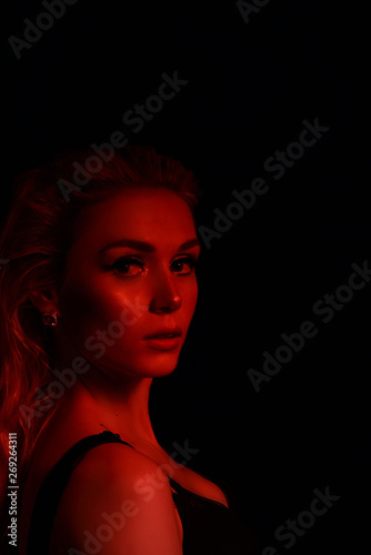 High Fashion model girl in colorful bright sparkles and neon lights posing in studio, portrait of beautiful sexy woman, trendy glowing make-up. Art design colorful make up. Glitter Vivid neon makeup