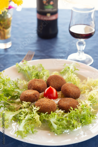 fried aubergine balls from the island of Panarea on a bed of green salad