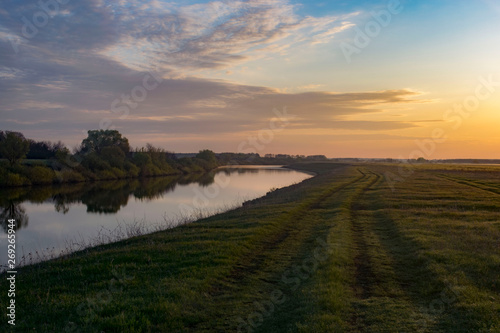 Dawn in a field near the river © Павел Горшков