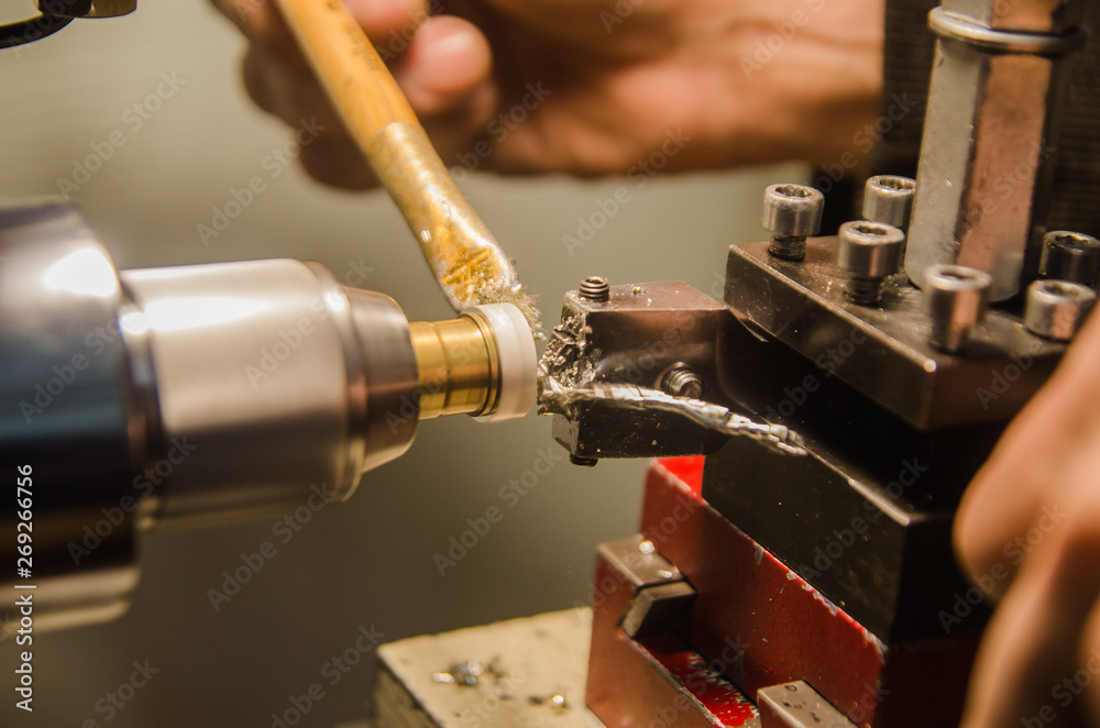 Fototapeta premium Machining of cylindrical parts on a lathe machine.