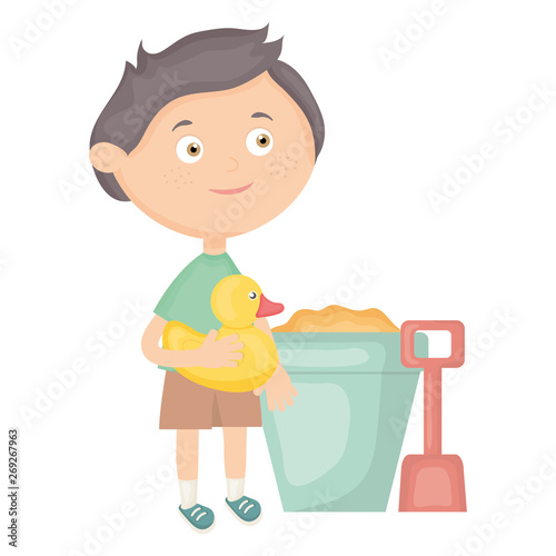 cute little boy with sand bucket and ducky