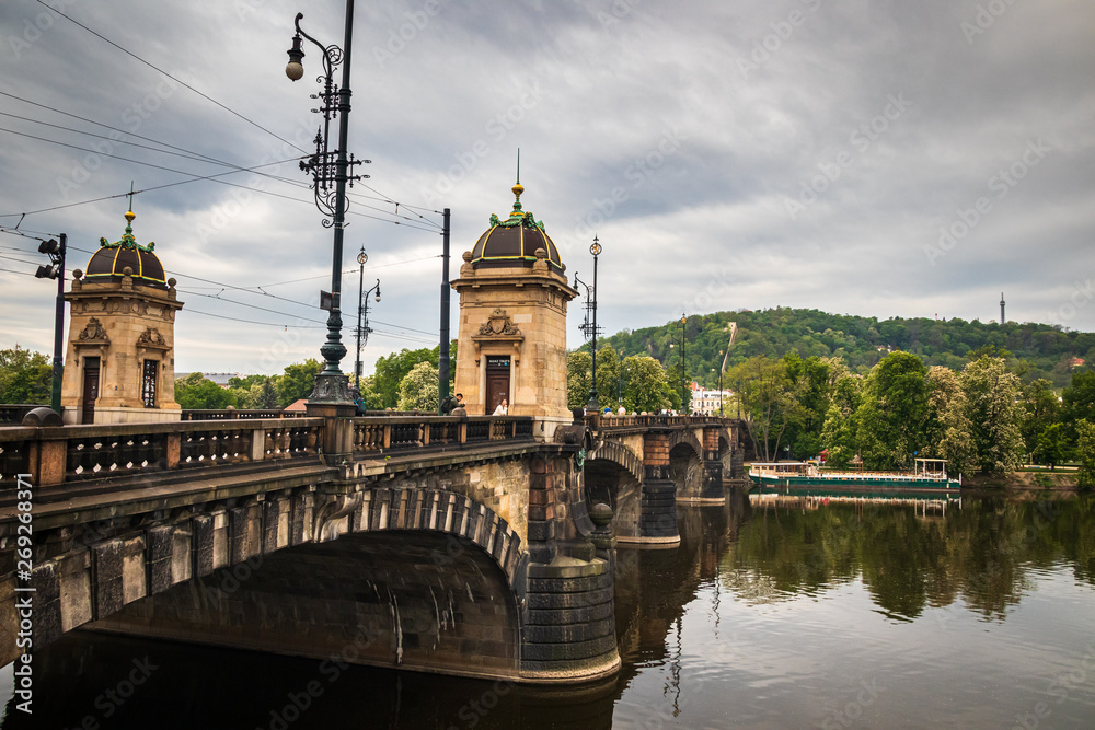 Beautiful Vltava river in Prague with old town and historical buildings in the background