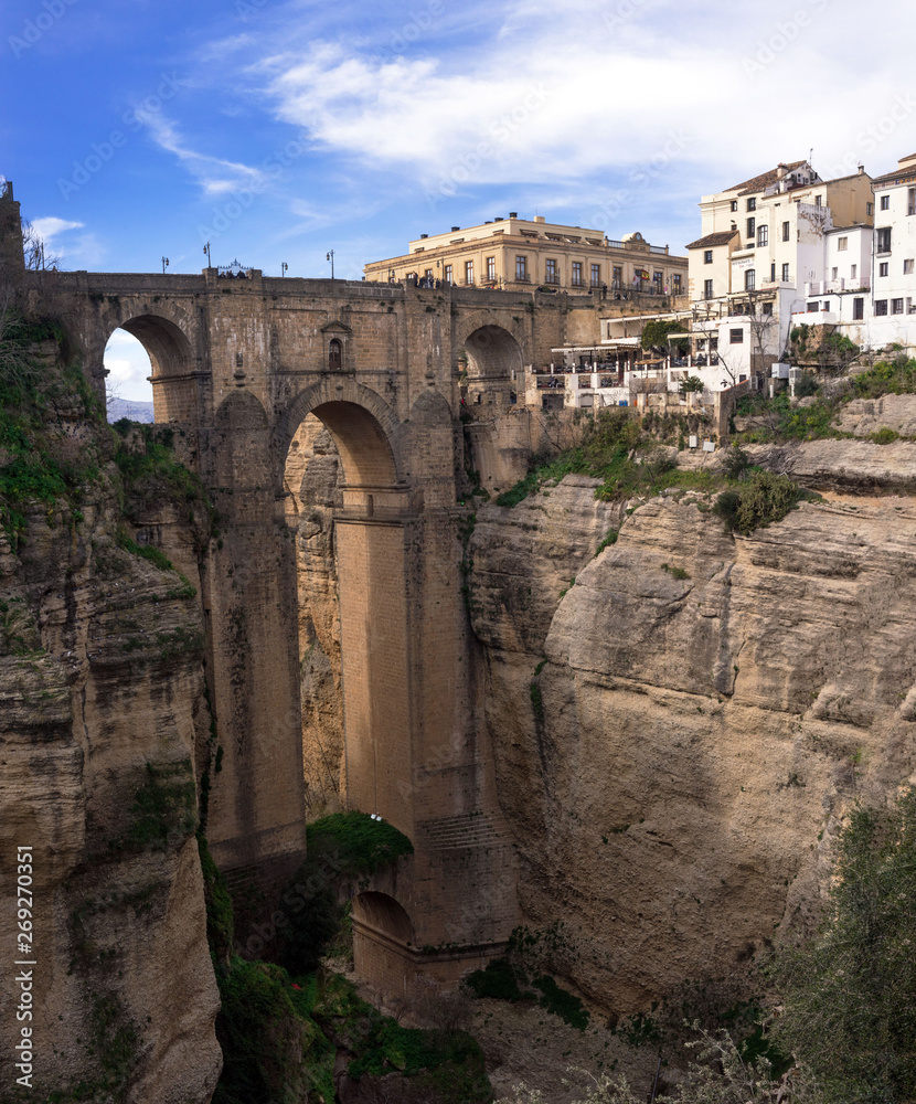 Ronda, Spain, February 2019. The famous Puente Nuevo is a new bridge over the Guadalev?n River over the gorge of El Tajo. Business card Rhonda. Andalusia.