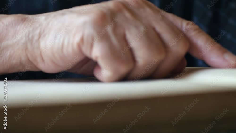 Elderly Man Leafing And Reading A Paper Book. Elderly Man Leafing And Reading A Paper Book.