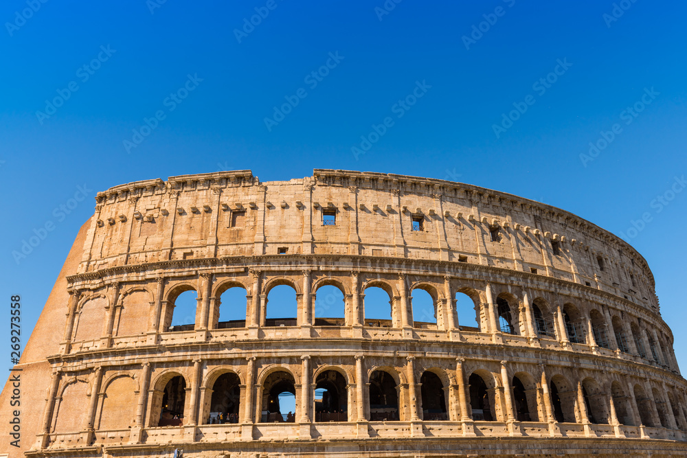 The Colosseum in Rome with blue sky, Italy 